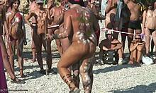 Young brunette dancing in paint: nudist XXX